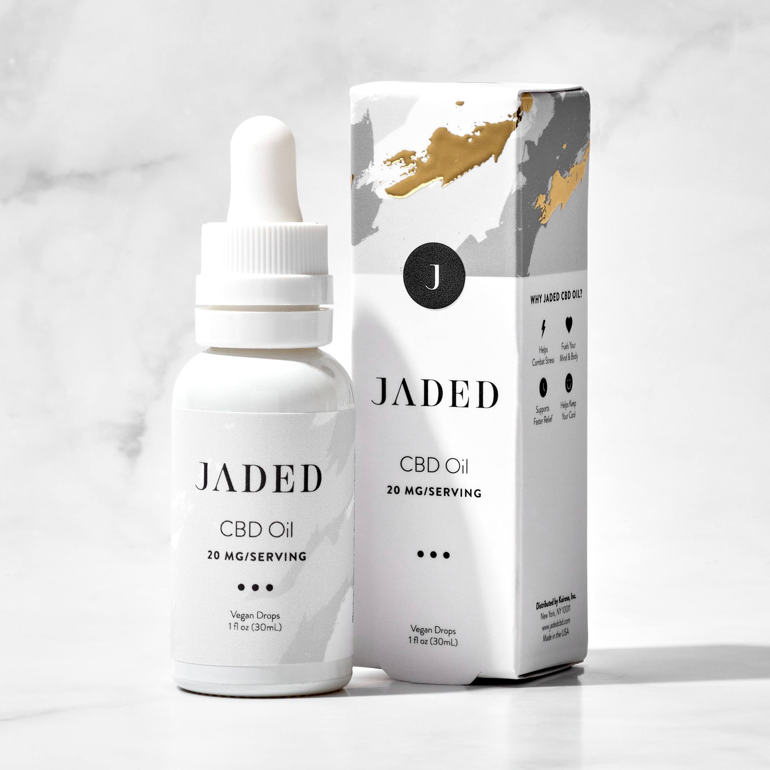 Jaded CBD oil bottle and packaging on a light gray background